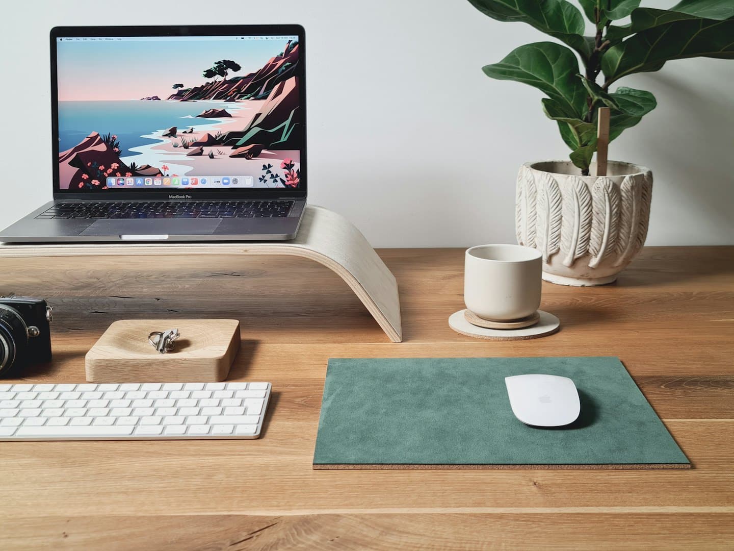 Modern office desk setup featuring a laptop and office accessories.